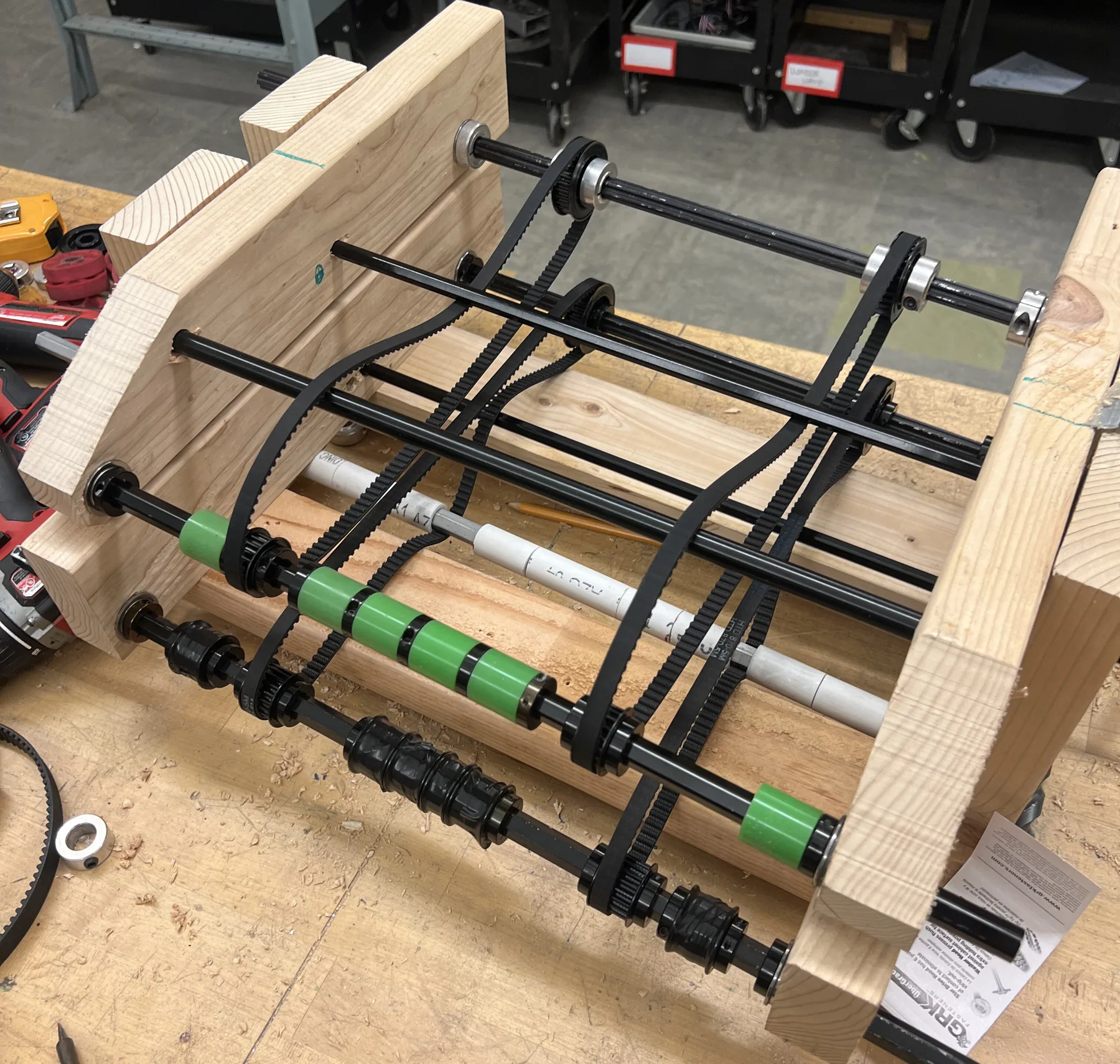 Intake V2: wooden test rig with several rows of small wheels on shafts for grip comparison