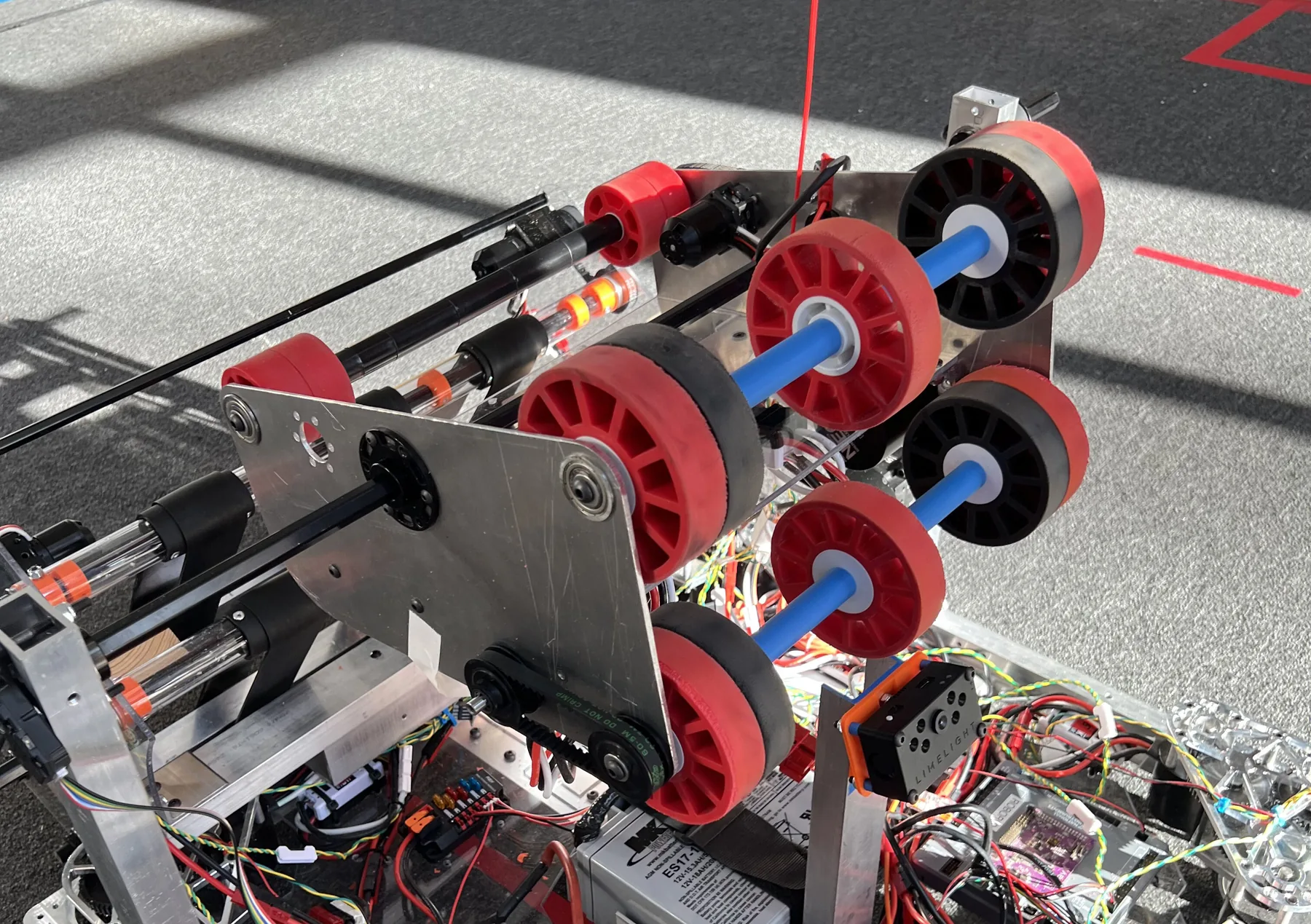 Shooter V3: two rows of red flywheels on an aluminum frame with a hood plate