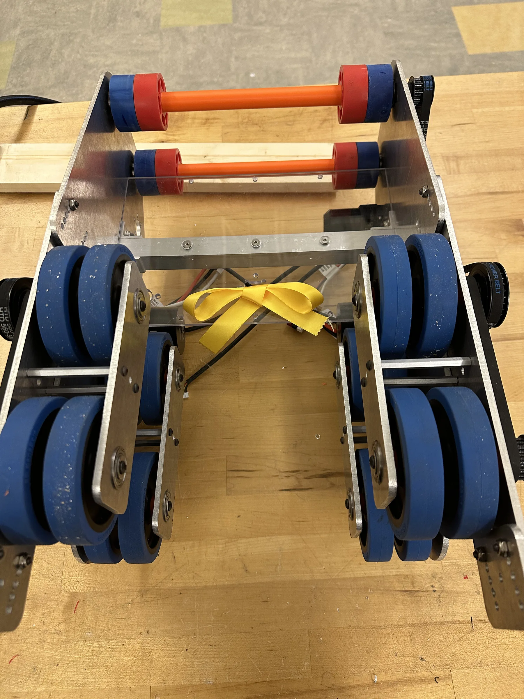 Shooter V4: blue flywheels on an aluminum frame with orange-capped motors and belts