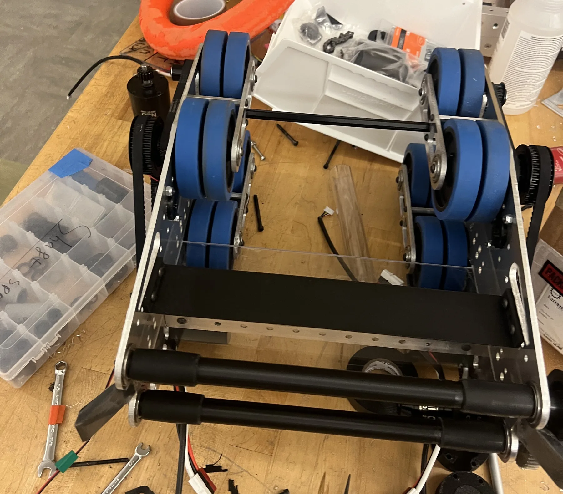 Final shooter V5 on the workbench: dual blue flywheels with a funnel-shaped entry