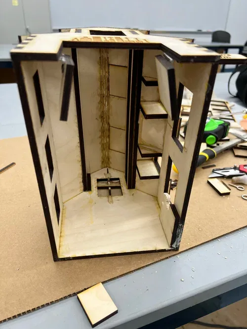Barn body standing on cardboard with the roof and walls dry-fitted together