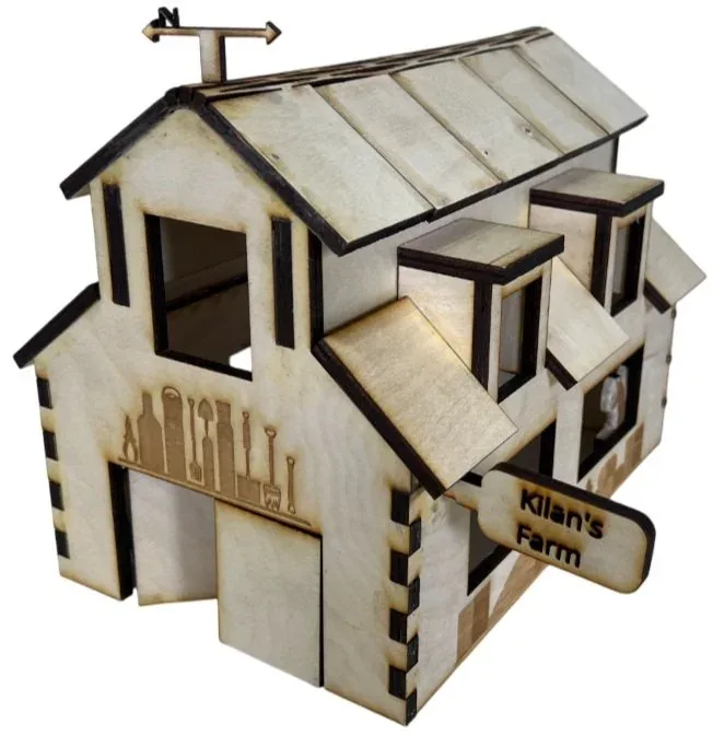 Finished barn from the front-left with engraved farm tools beside the door and the 'Kilan's Farm' sign