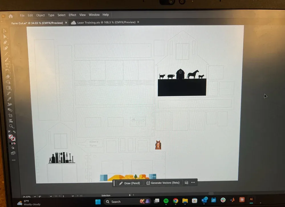 Monitor showing the barn parts nested in Adobe Illustrator for the laser cutter