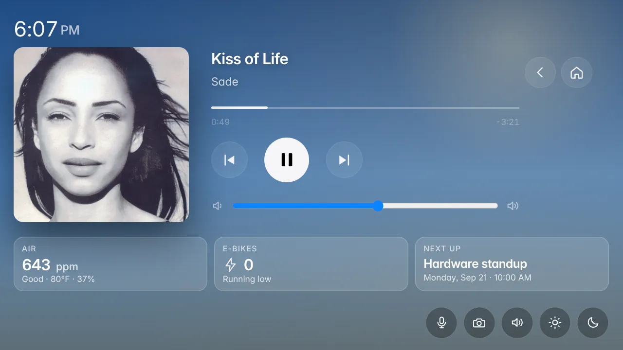 HomeDeck Now Playing screen: album art, track title and artist, a progress bar, transport controls and a volume slider, with the air, e-bikes and next-up tiles below