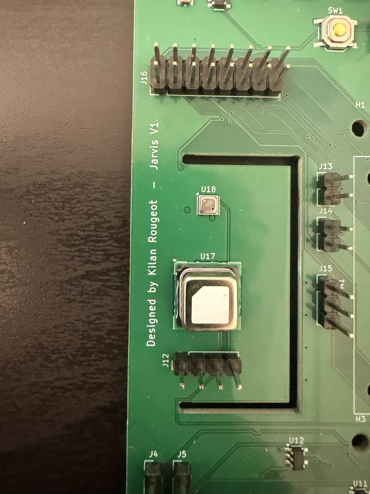 Close-up of the SCD40 sensor on the board tongue next to the silkscreen text Designed by Kilan Rougeot, Jarvis V1