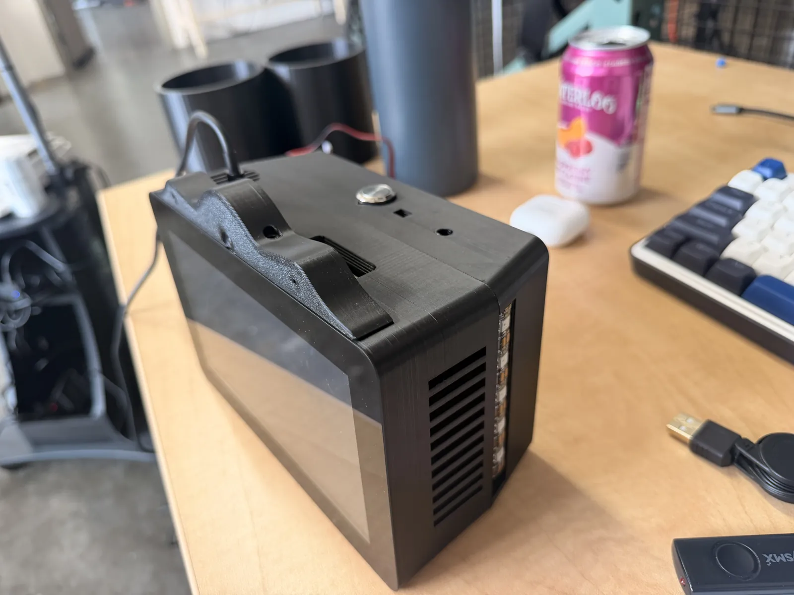 The side of the finished HomeDeck enclosure with the fan vent, the LED bar and the top button
