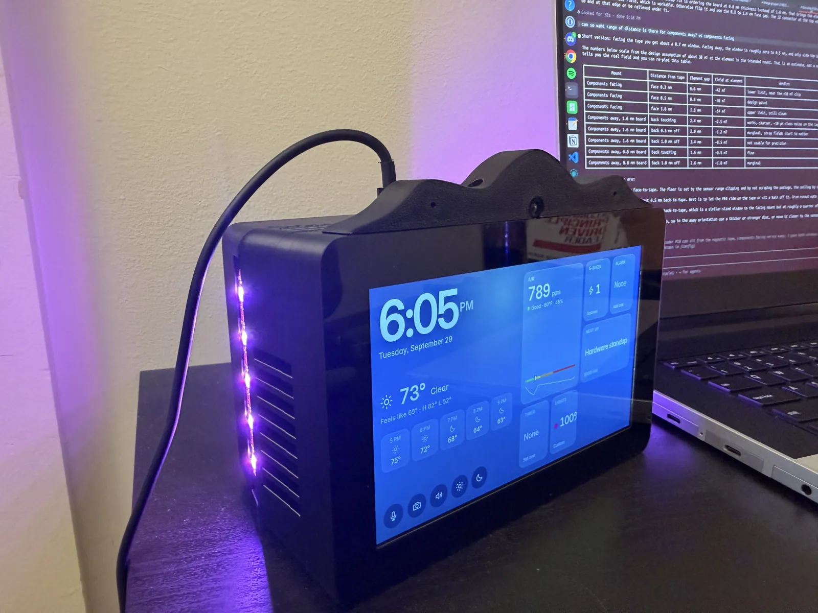 The HomeDeck at night with the side LED bar lit purple and the home screen on