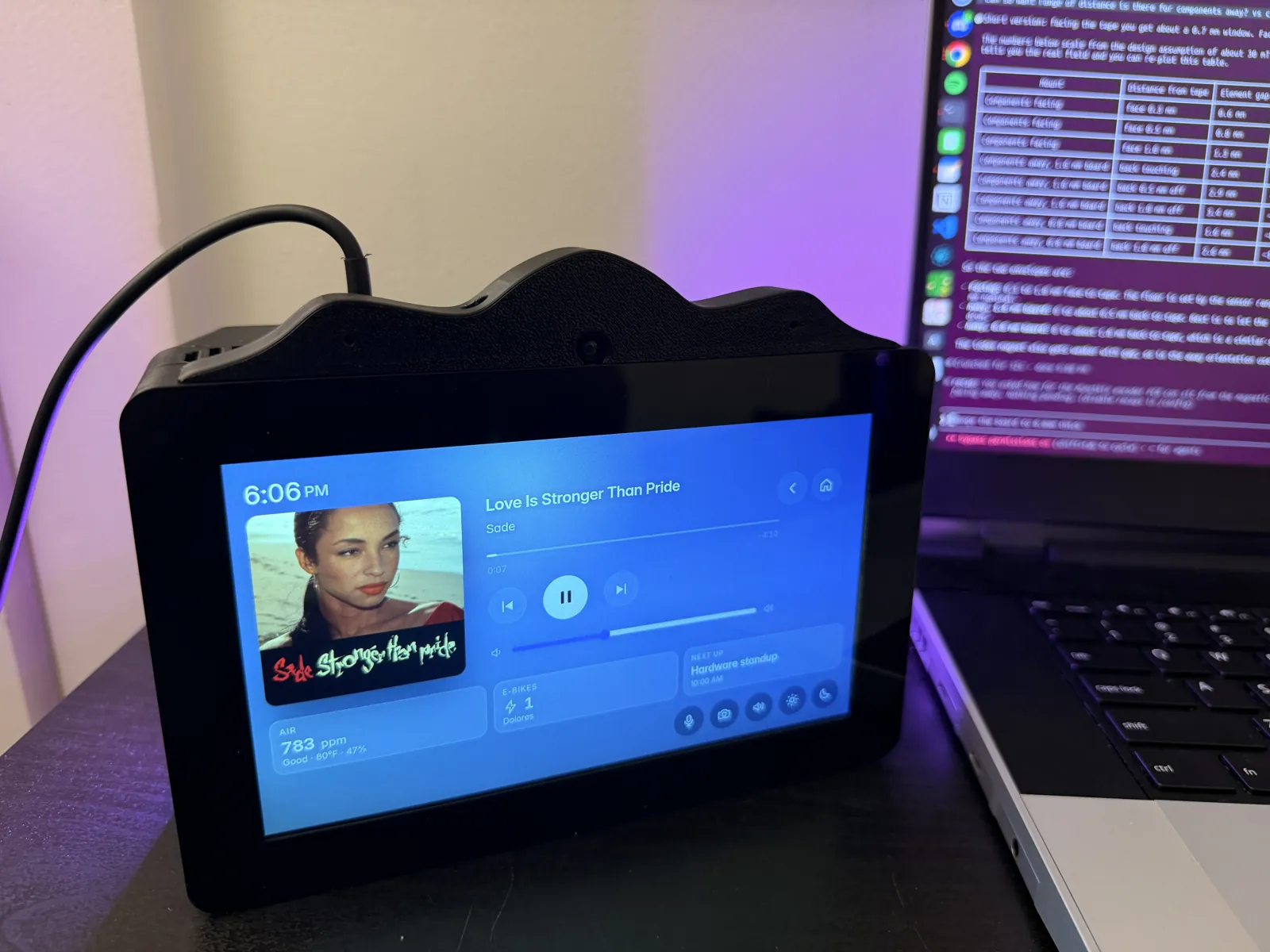 The HomeDeck at night showing the Music app with the LED bar lit purple